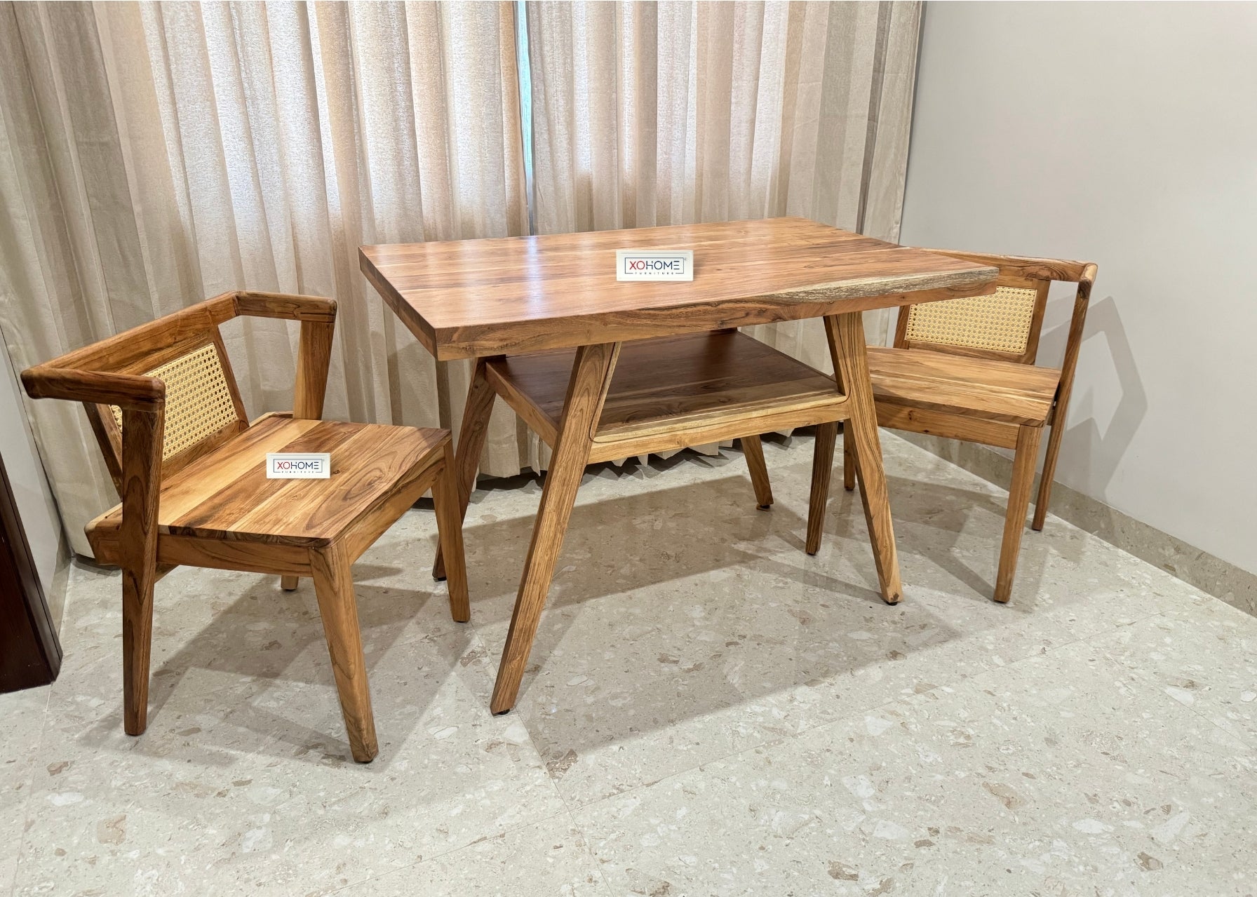 Milan 2 seater Dining Set by XOHOME – Compact solid wood dining set with space-saving design. Features rattan-accented chairs that slide completely under the table, perfect for small spaces and modern interiors.