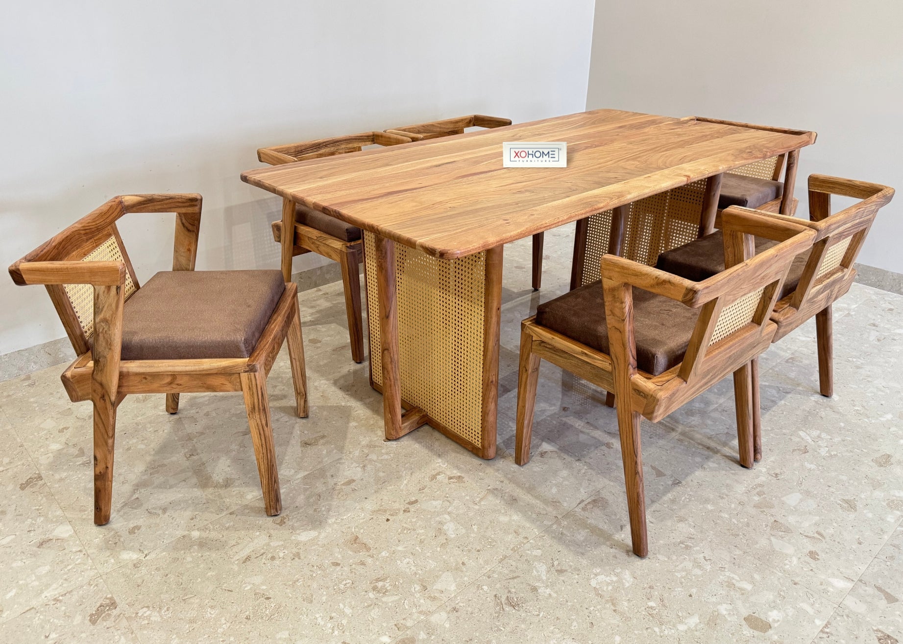 Indra Dining Set by XOHOME – 6-seater pure solid wood dining set with rattan accents, featuring stylish chairs and a sturdy dining table, perfect for modern and traditional dining spaces.